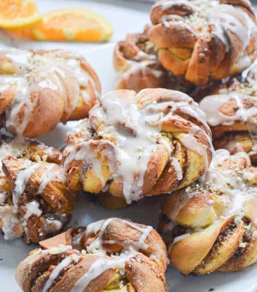 iced cinnamon hazelnut knots on a plate