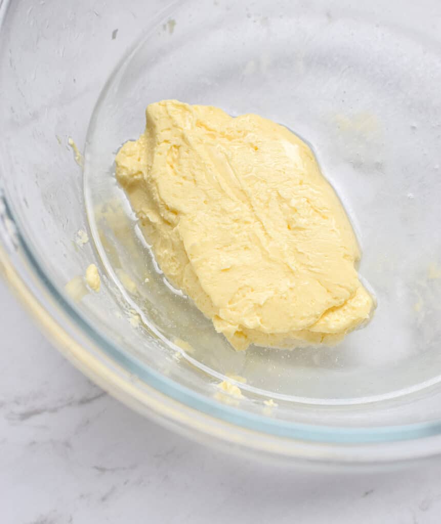 cultured butter clump inside a glass bowl on kitchen bench
