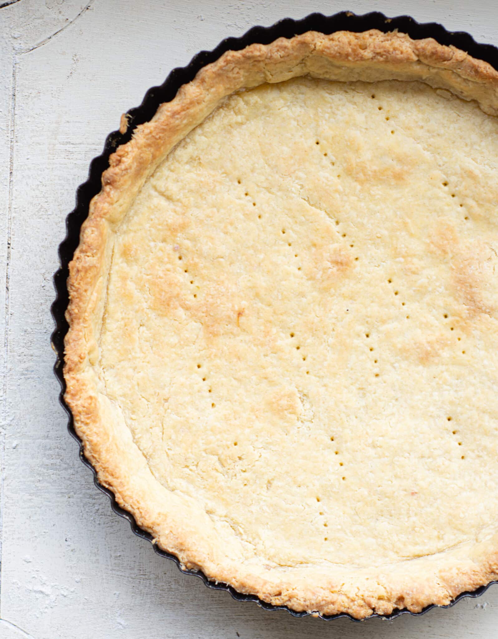 a baked pie crust in a tart tin