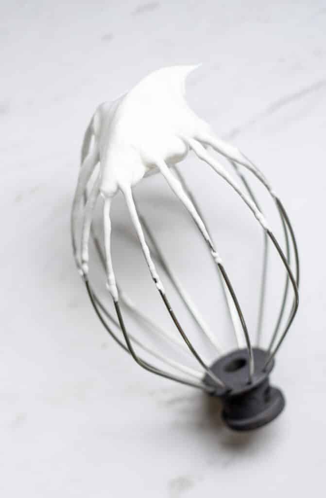 A whisk with egg whites