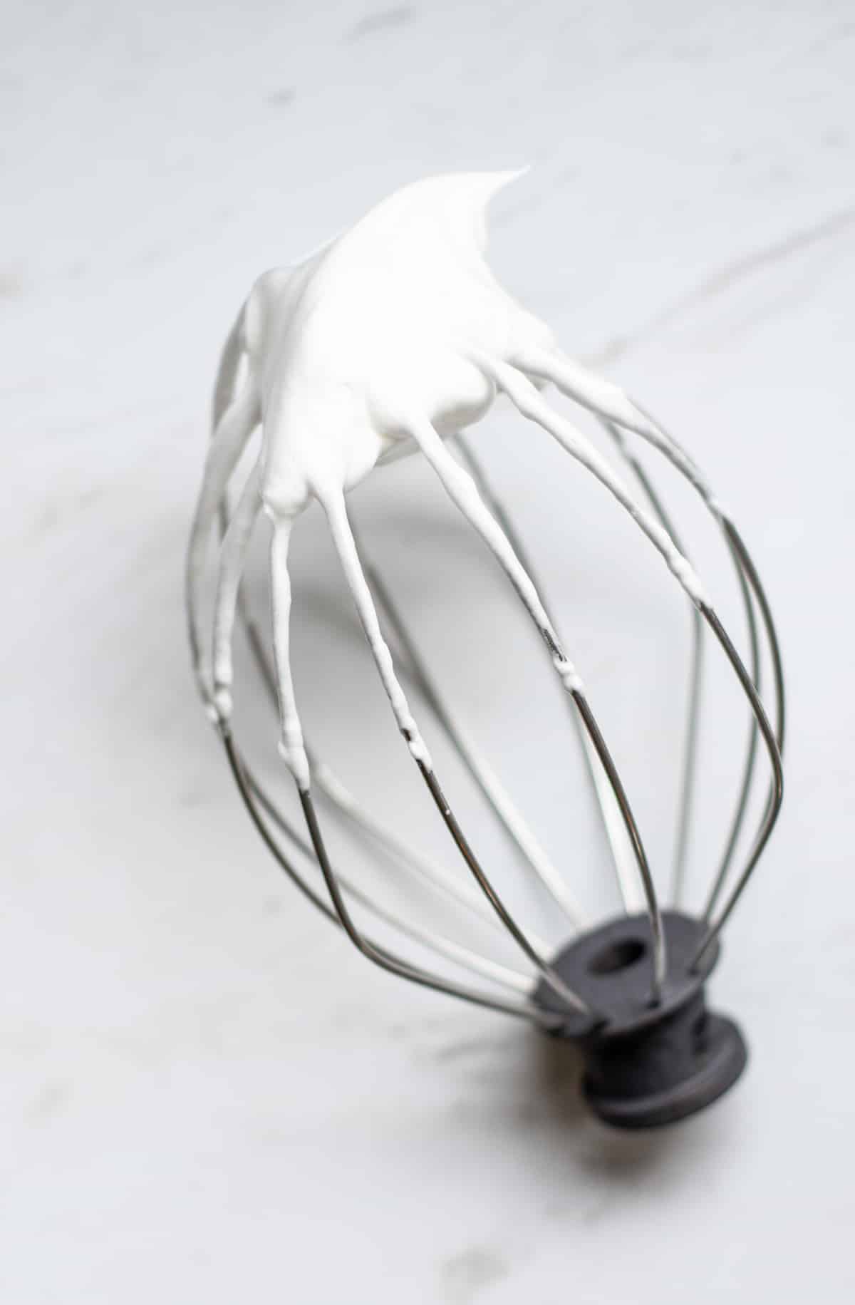 A whisk with egg whites