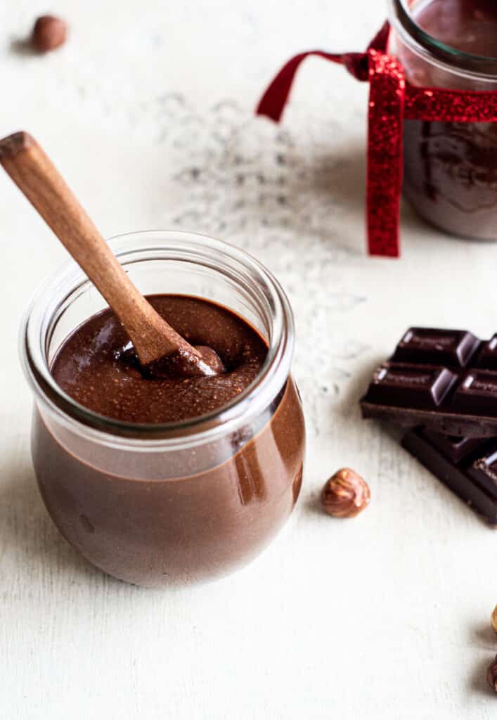 hazelnut chocolate spread in small glass jar