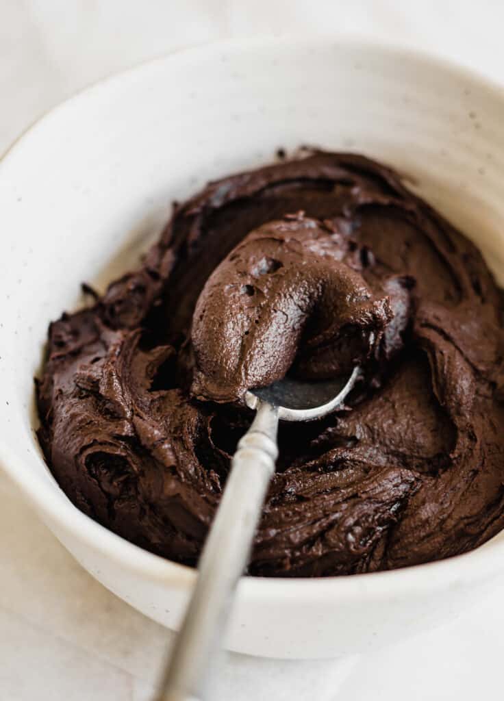 chocolate icing in a white bowl
