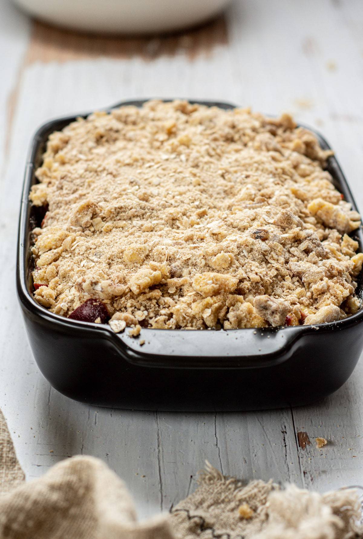 unbaked peach crisp with oatmeal top