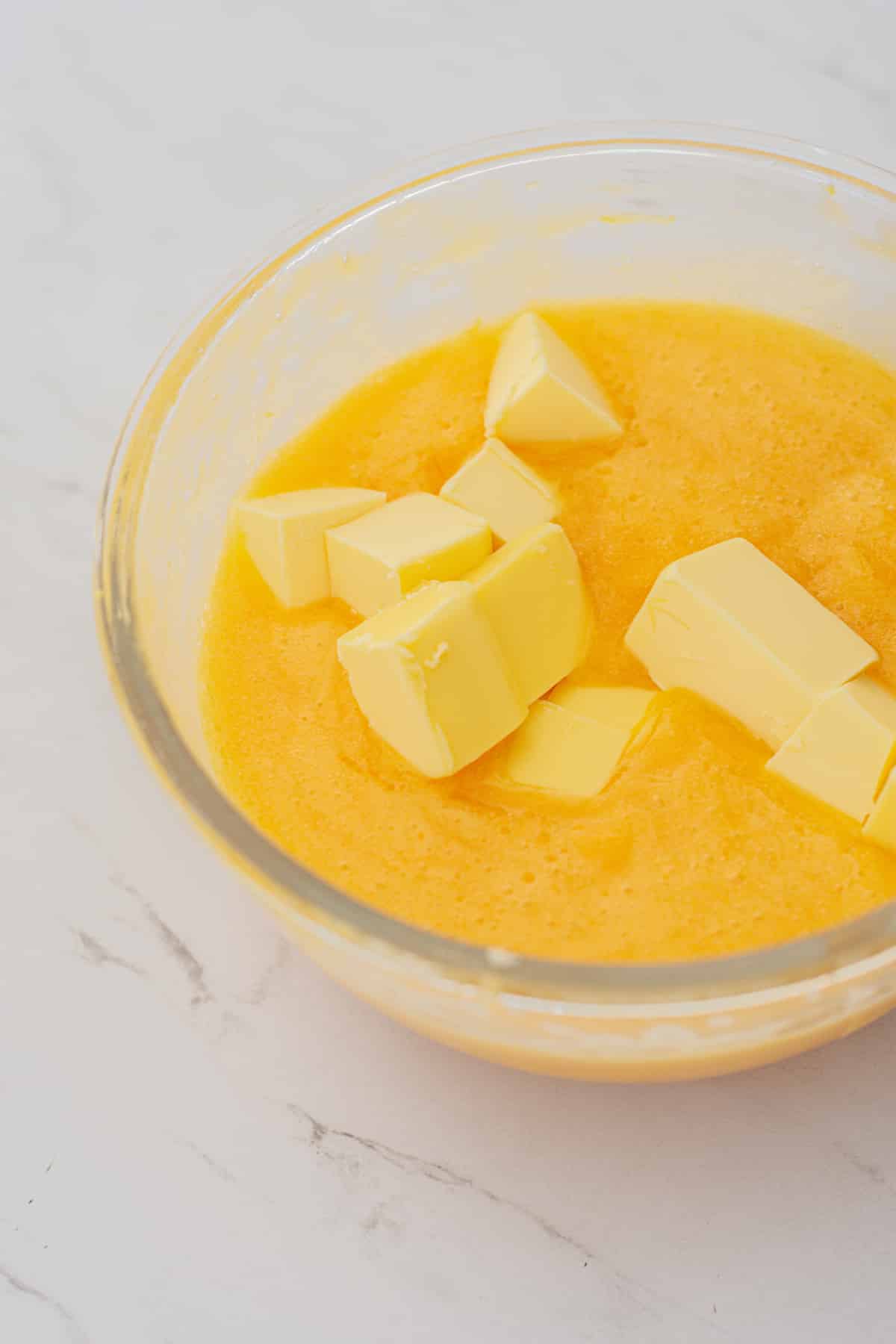 lemon curd in a bowl with butter.