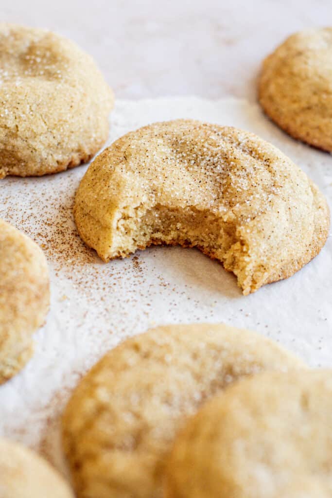 a bitten soft sugar coated snickerdoodle cookie.
