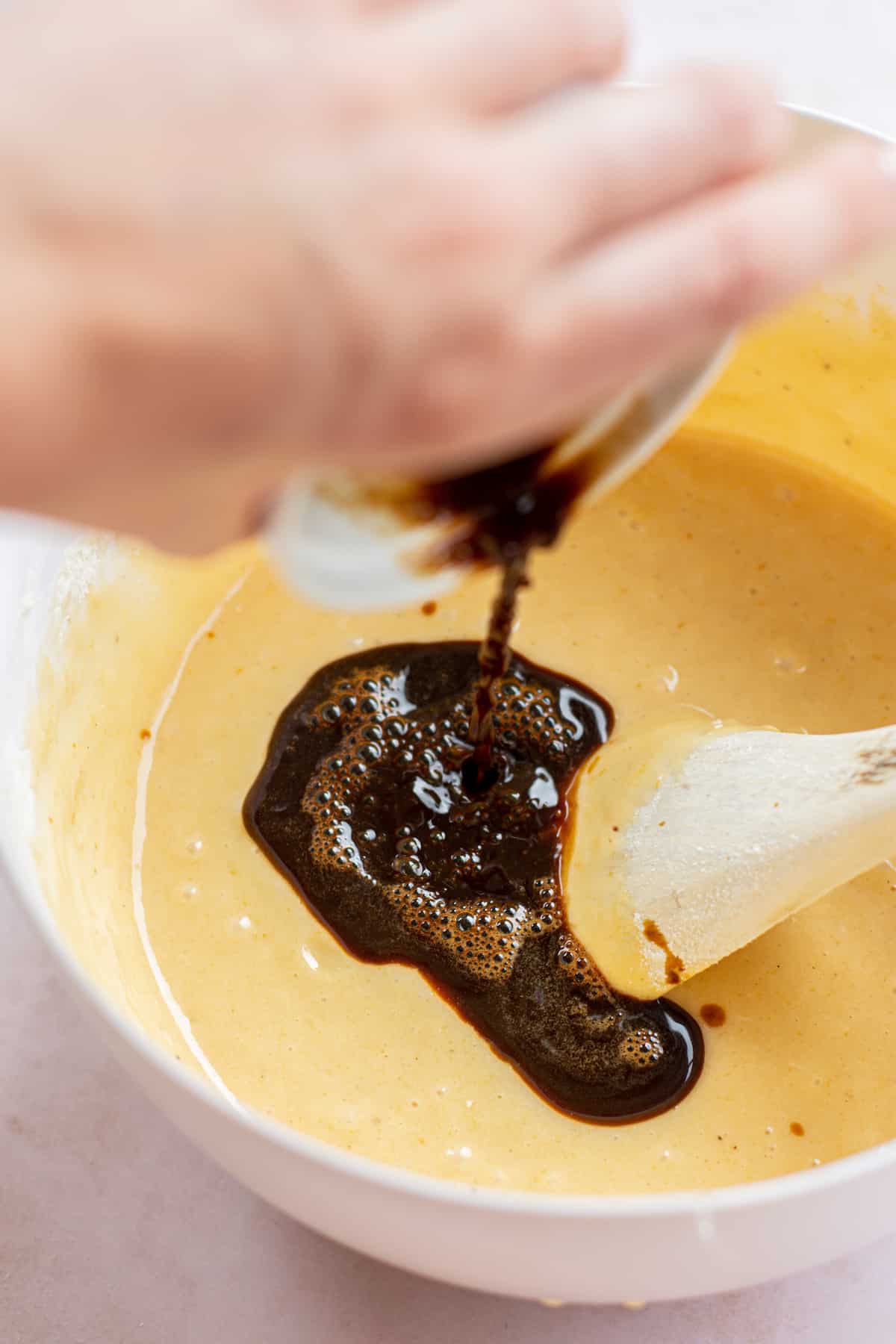 coffee poured into cake batter.