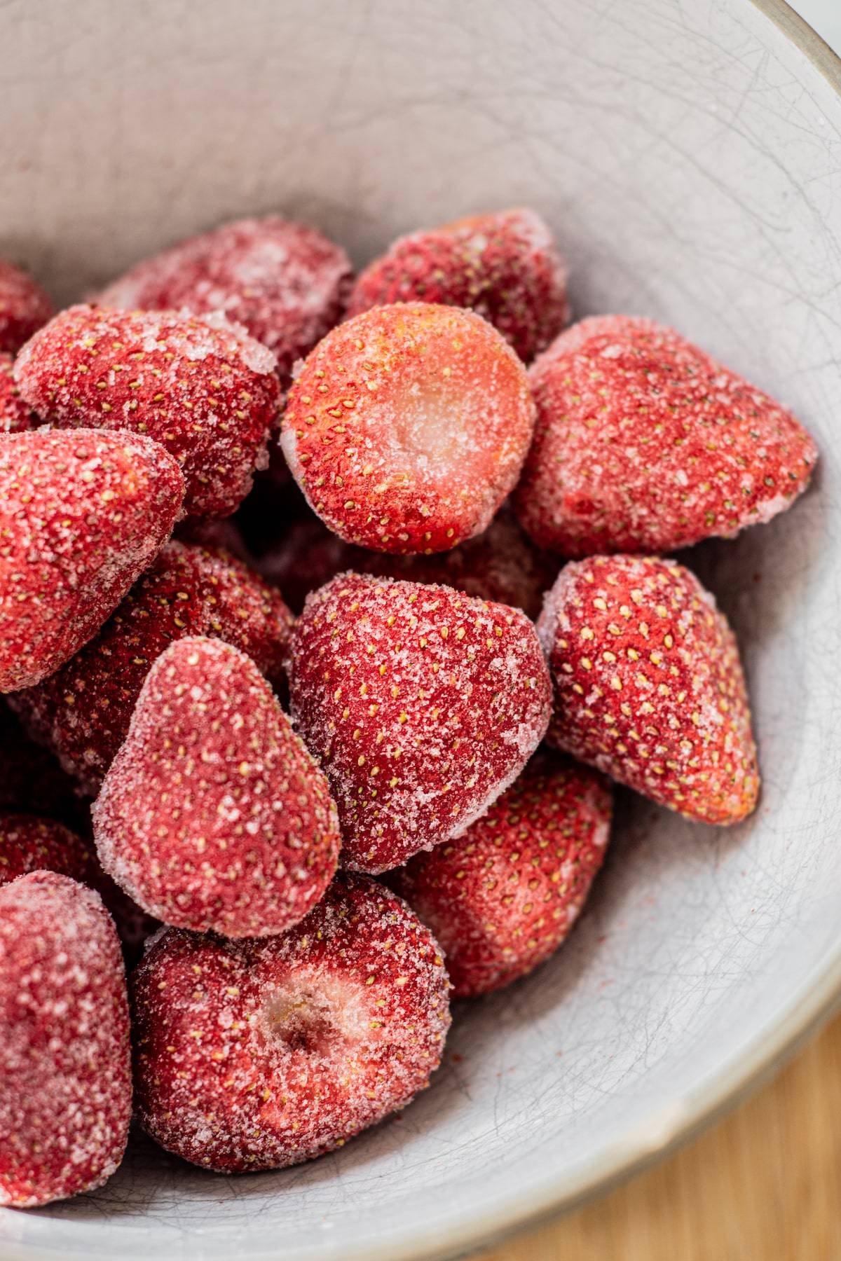 a bowl of frozen strawberries.