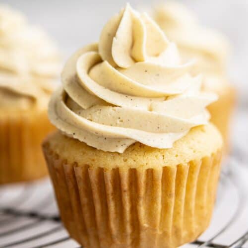 vanilla cupcake on rack.