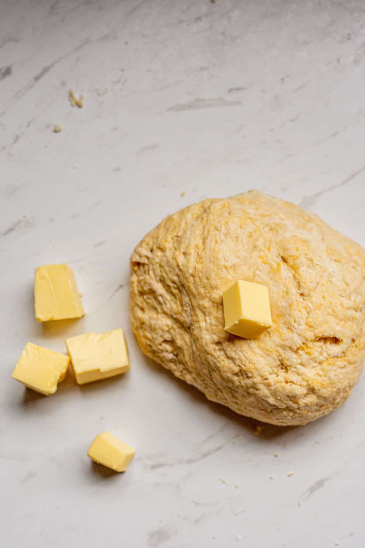 rough dough with butter cubes.