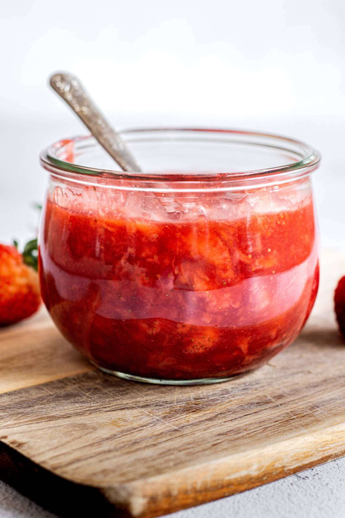 a jar of strawberry sauce.