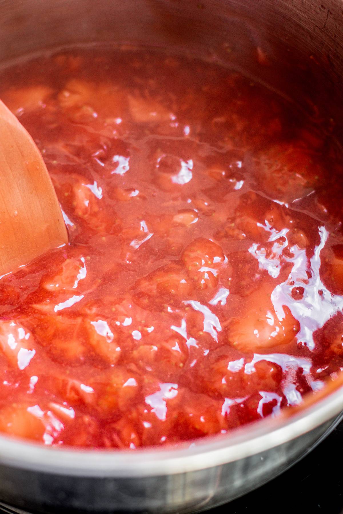 a saucepan of strawberry sauce.