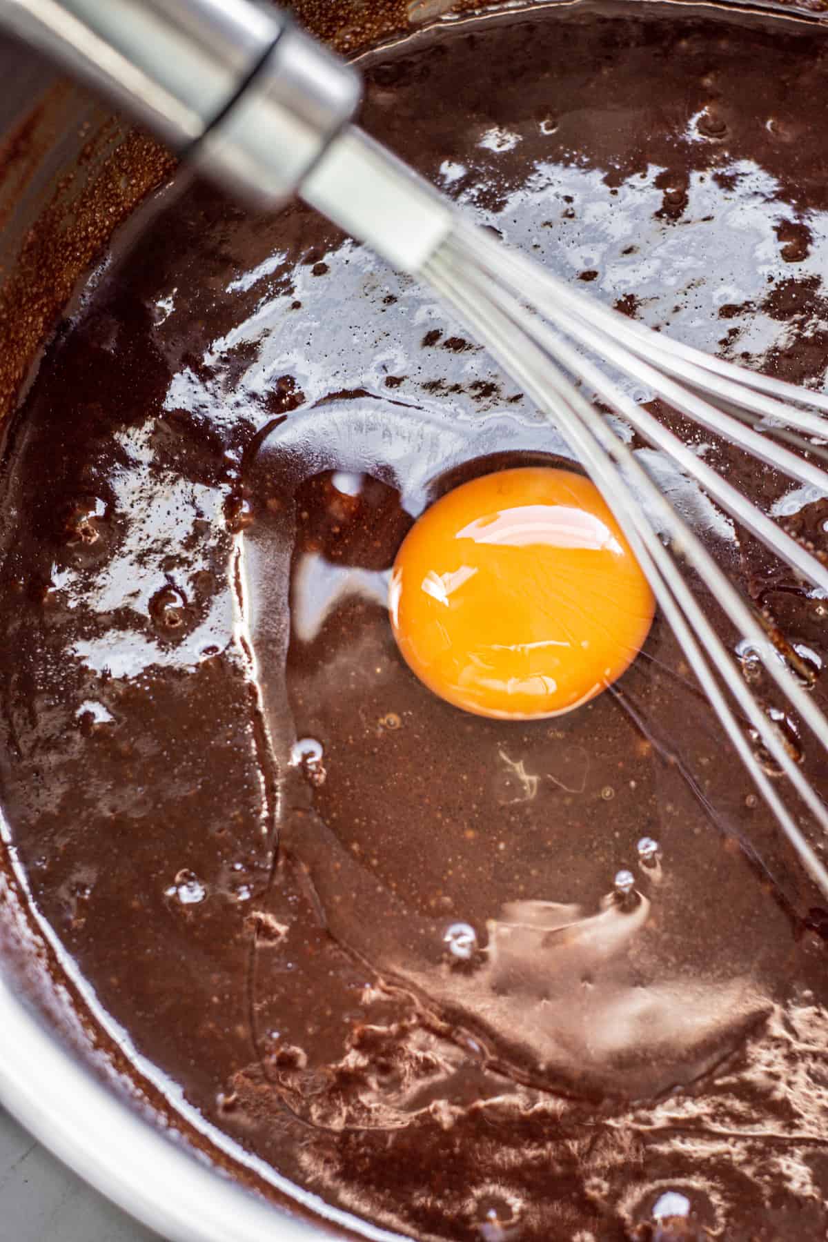 an egg in chocolate batter.
