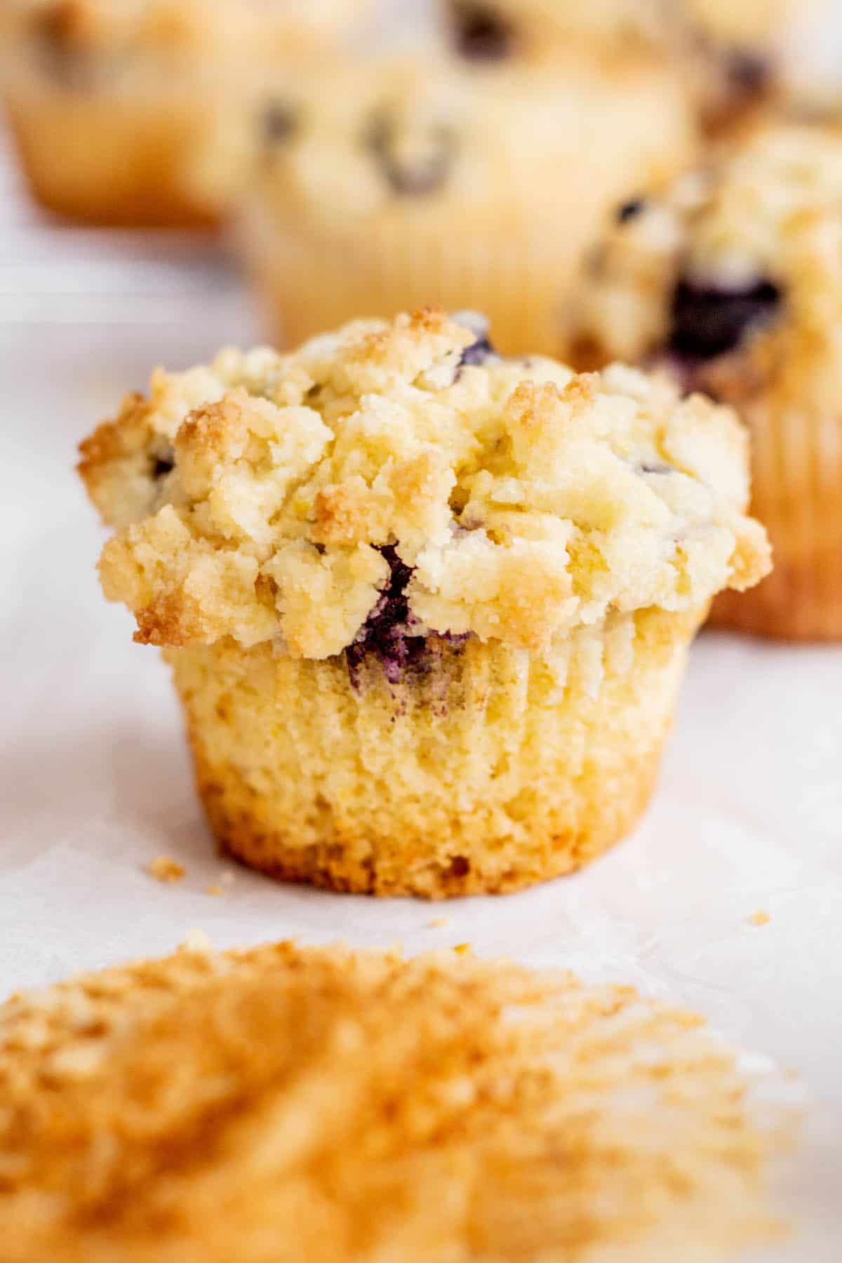 unwrapped muffin with streusel top.