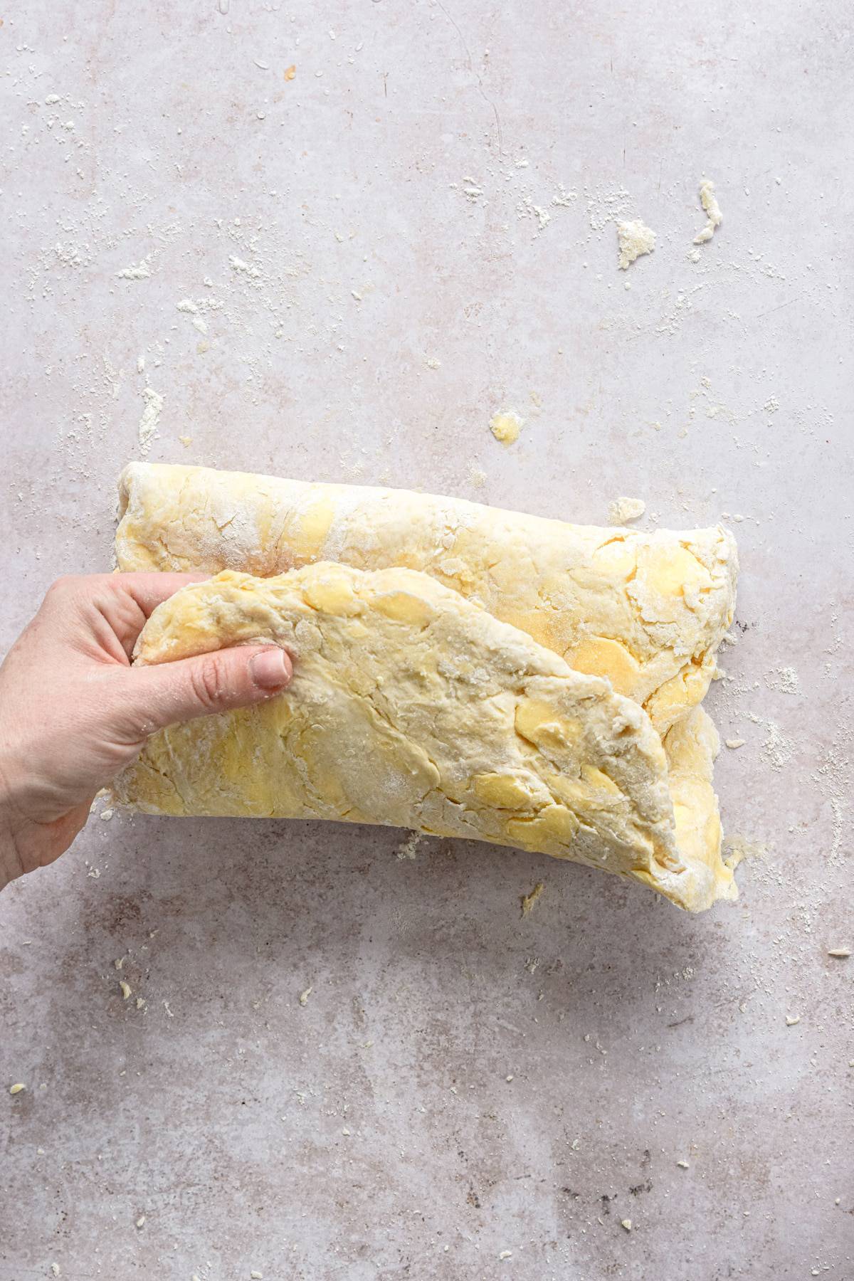 rough puff pastry being folded.