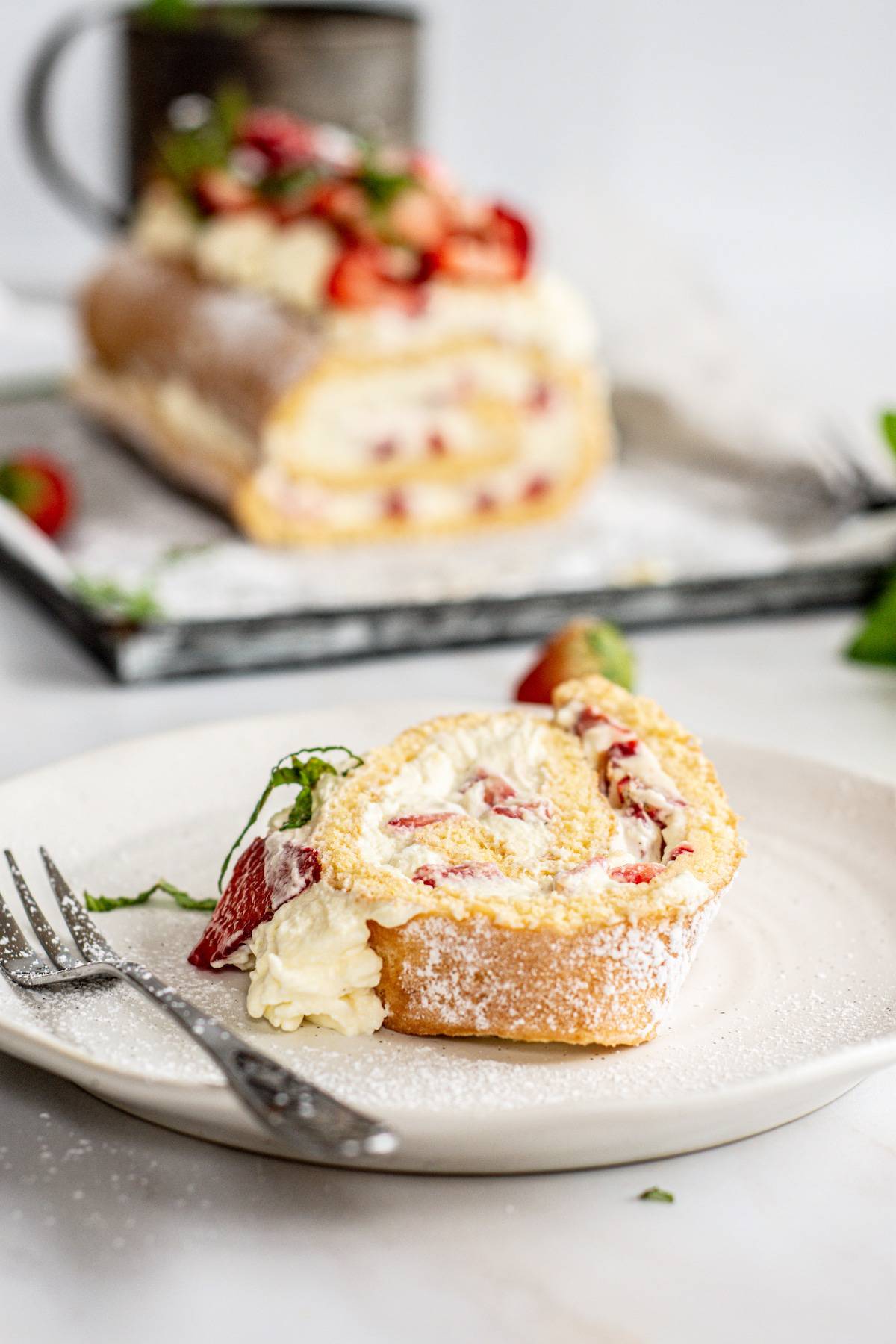 a slice of strawberries and cream cake.