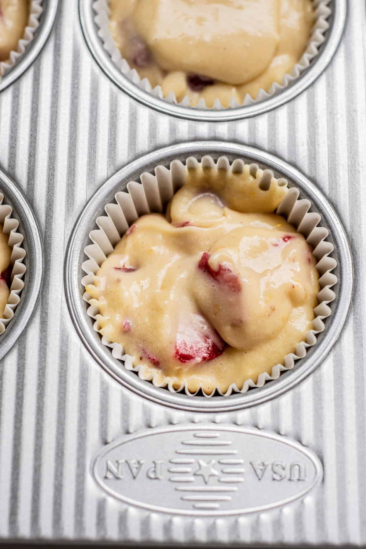 muffin batter in a pan.