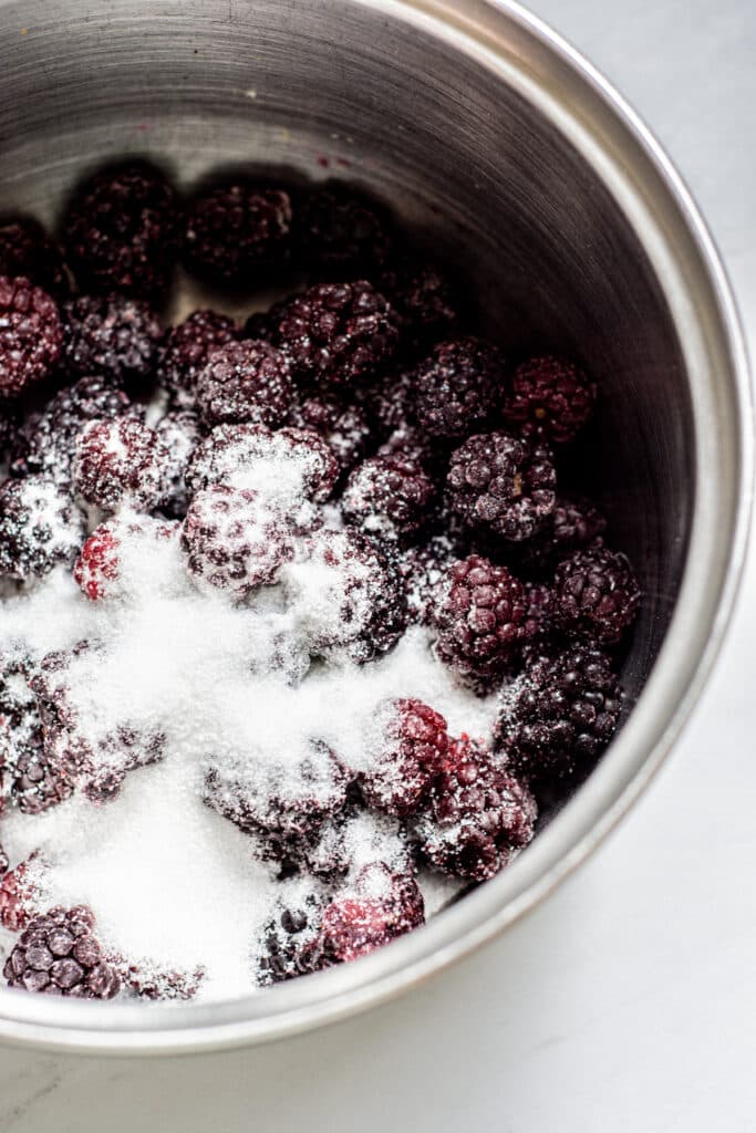 a pan of blackberries and sugar.