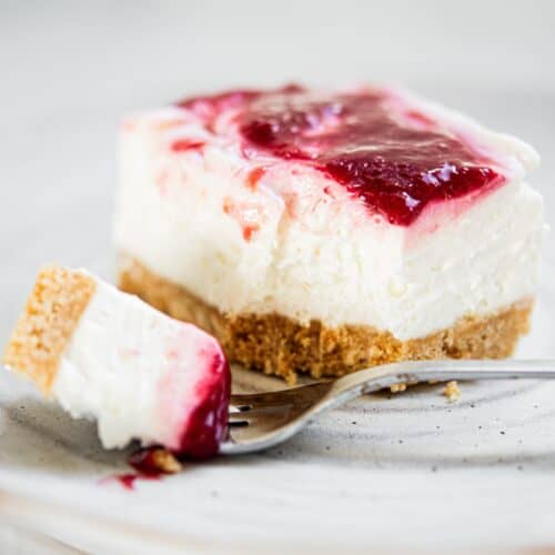 raspberry cheesecake on plate.