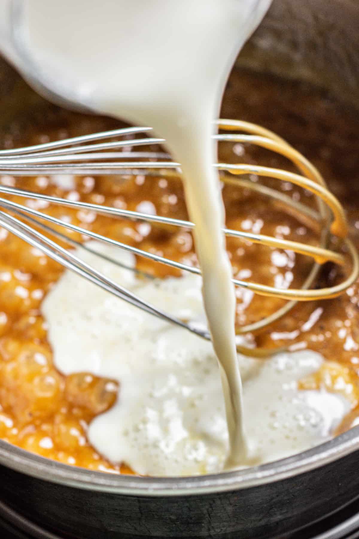 cream poured into a saucepan of caramel.