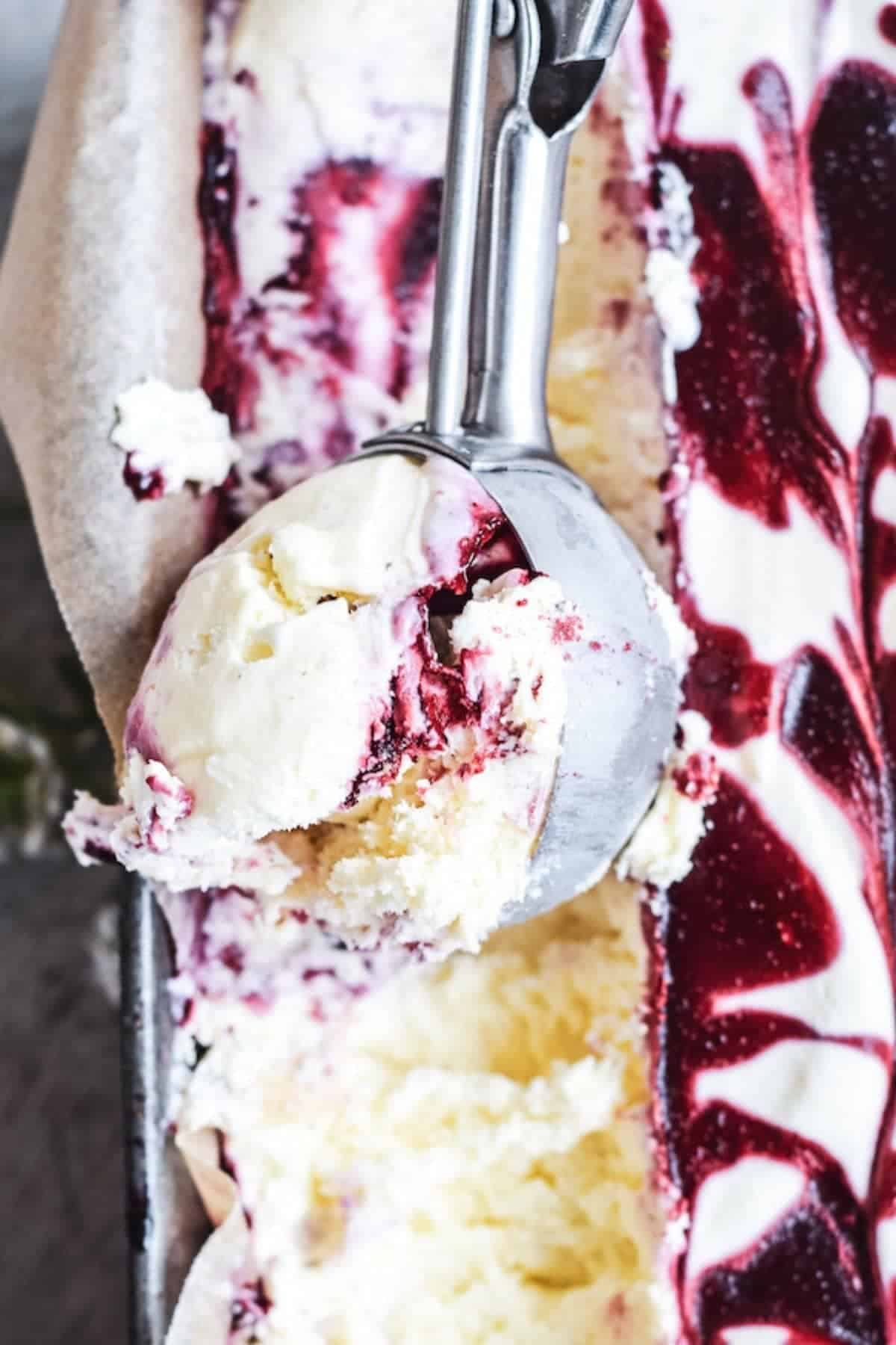a scoop of blackberry swirled ice cream.