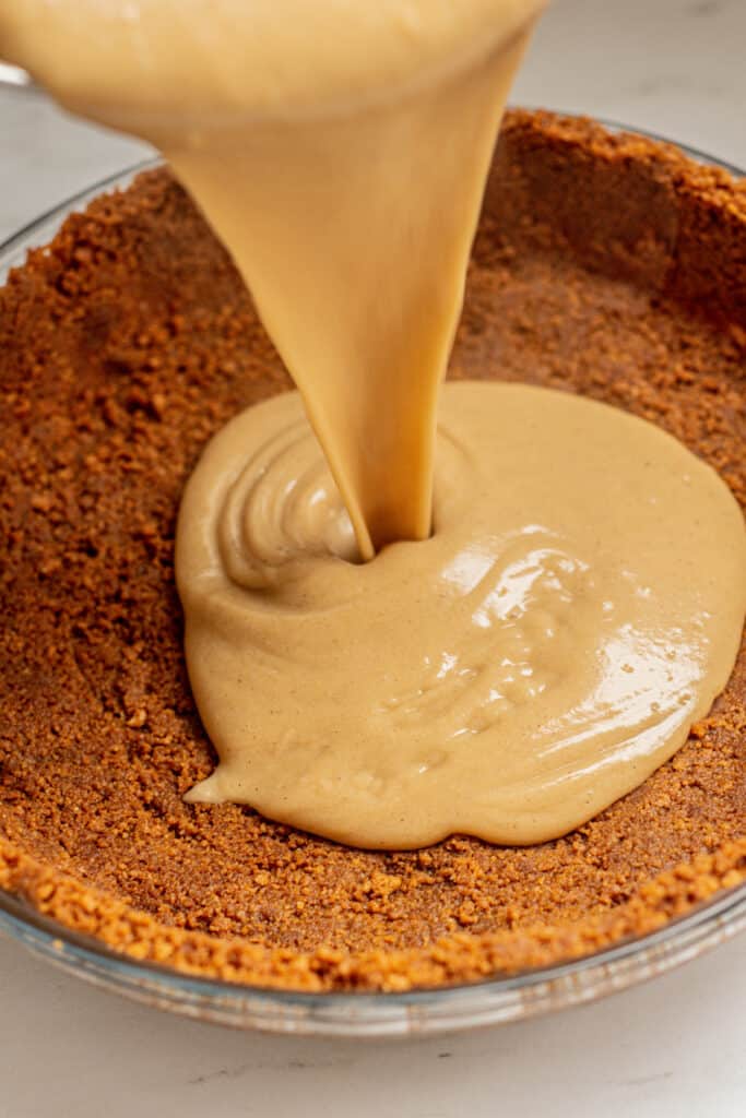 butterscotch pudding poured into biscuit base.