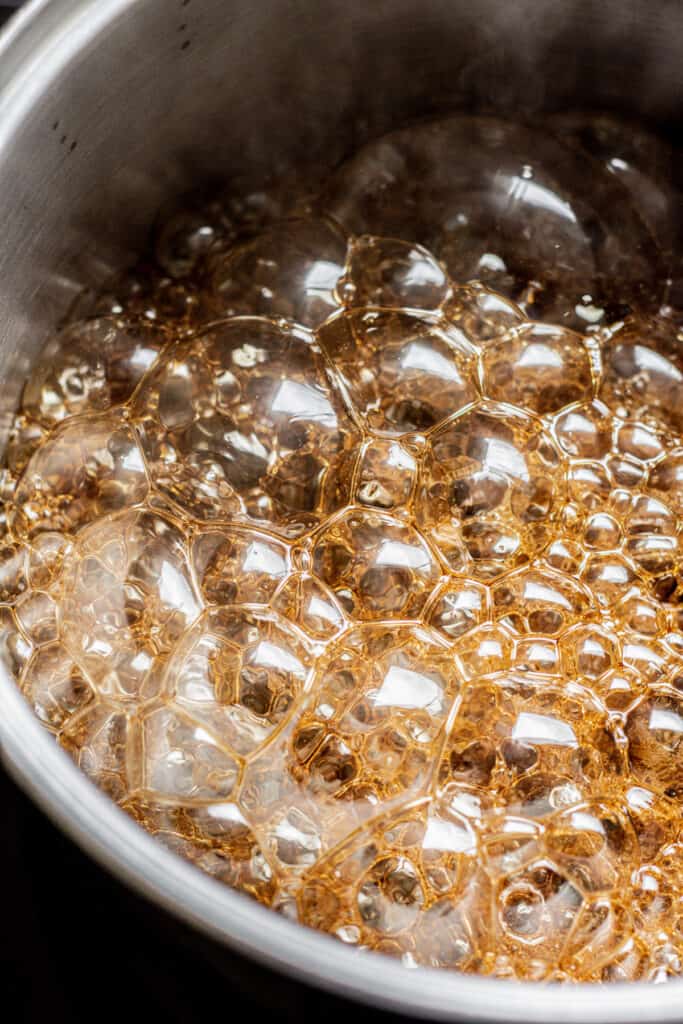 bubbles of brown sugar boiling.