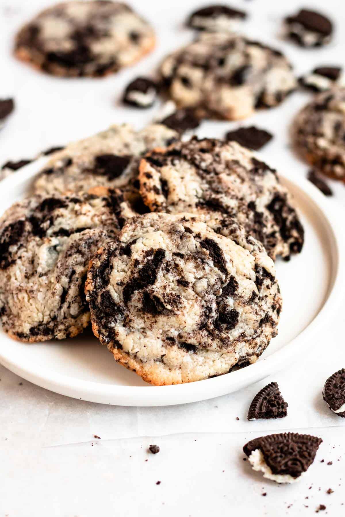 a plate of cookies with pieces of oreo.