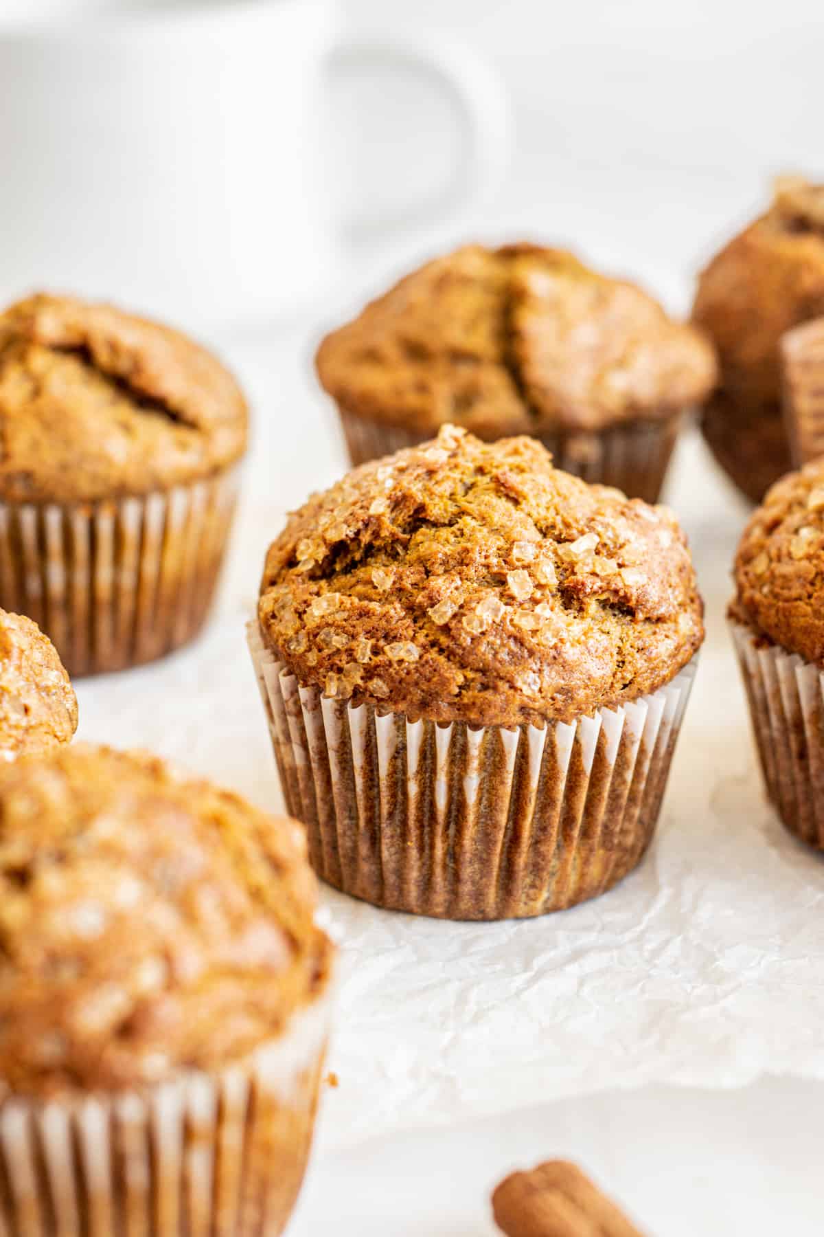 close up of muffins with coarse sugar on top.