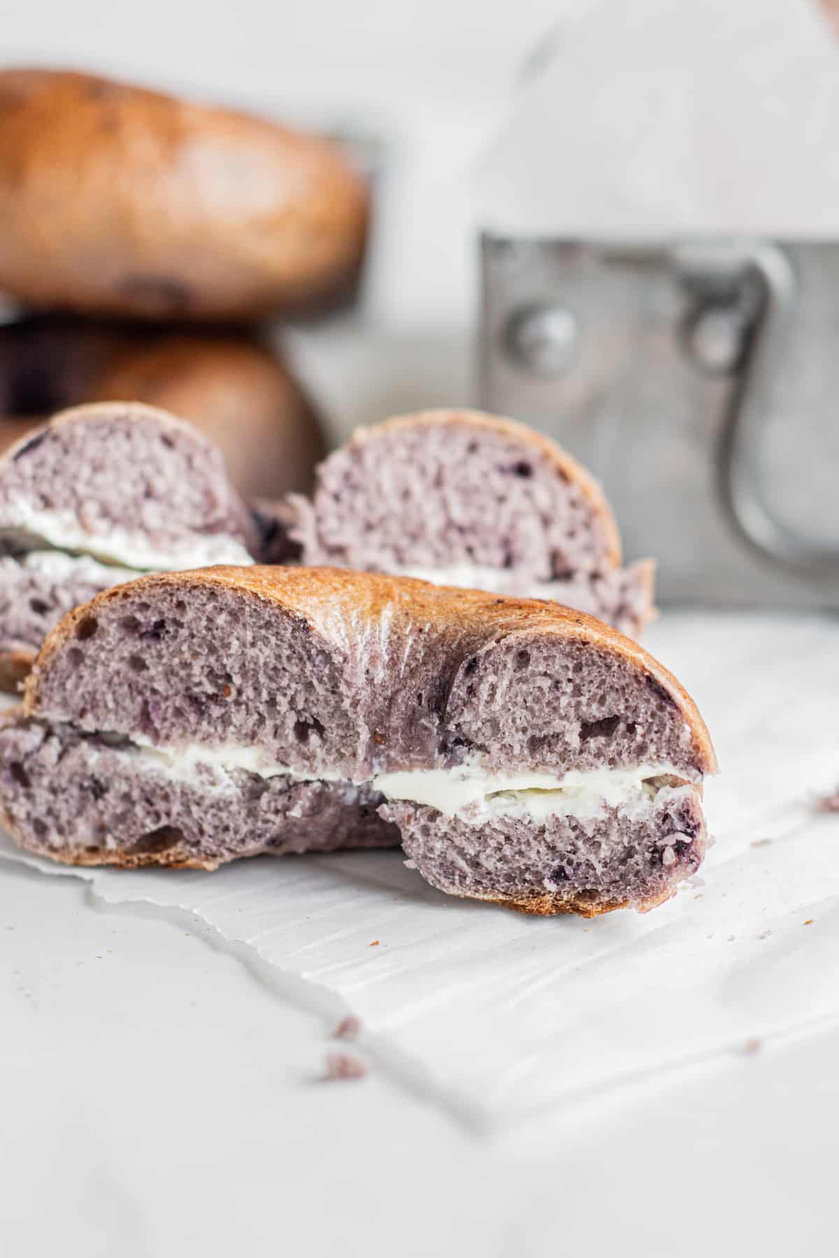 purple bagel with cream cheese inside.