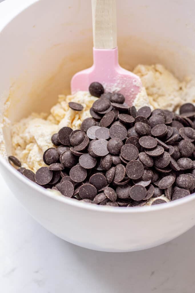 chocolate chips in a bowl of dough.