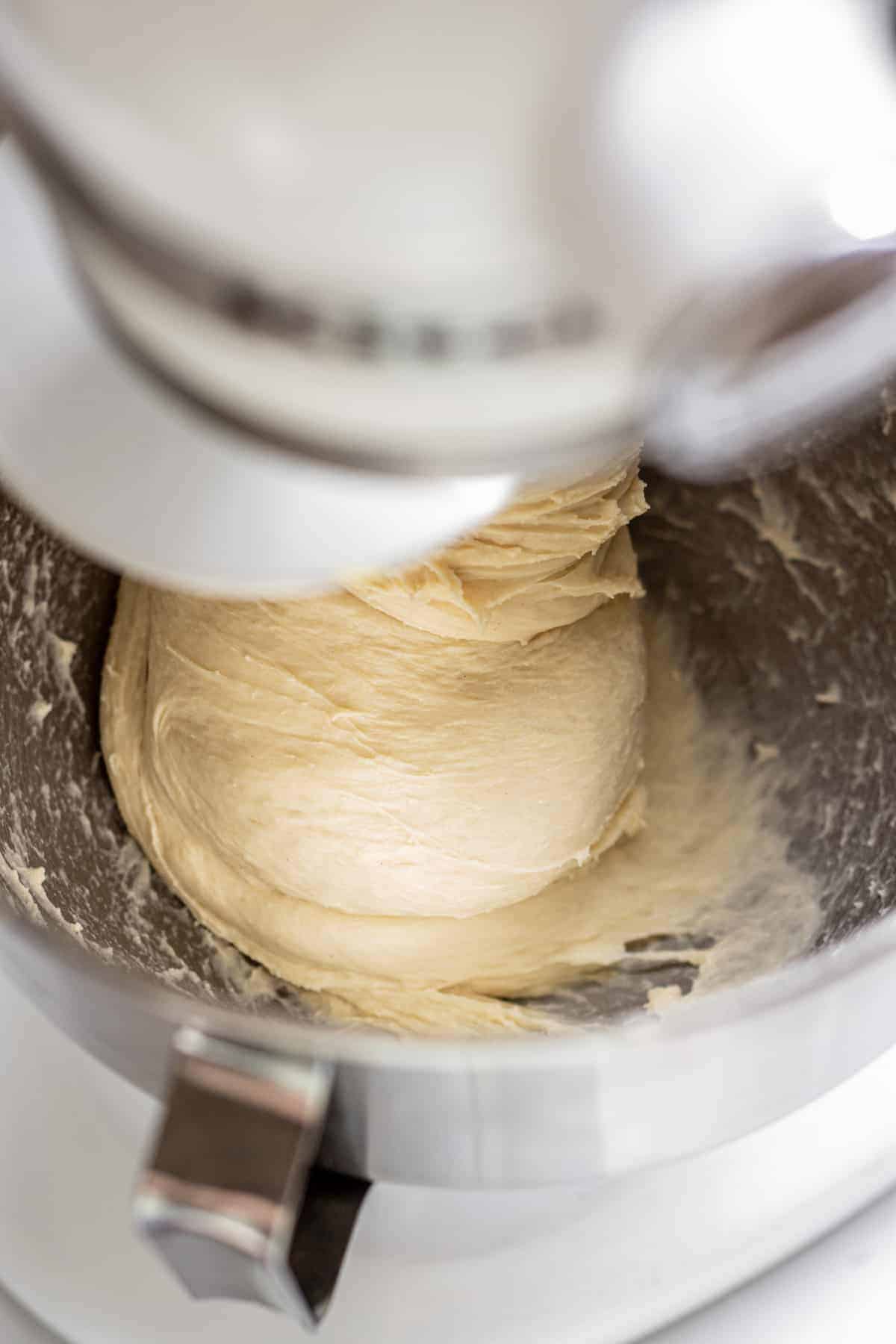 fluffy milk bread dough being mixed.