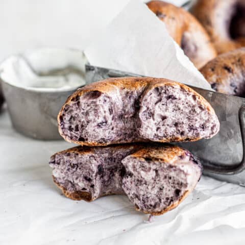 a ripped in half purple bagel.
