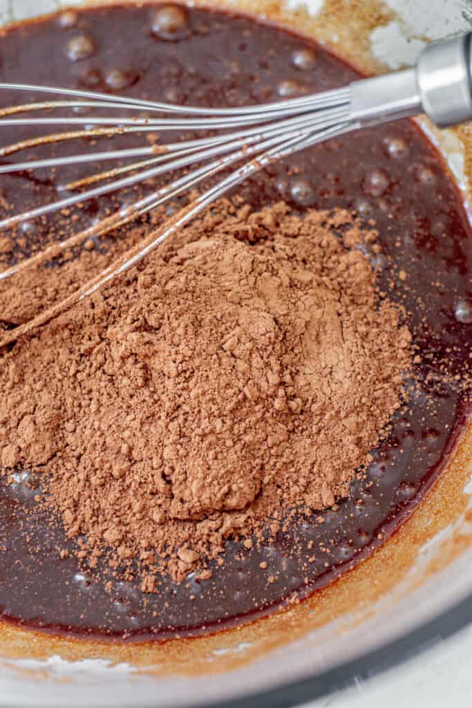 cocoa powder in a bowl of batter.