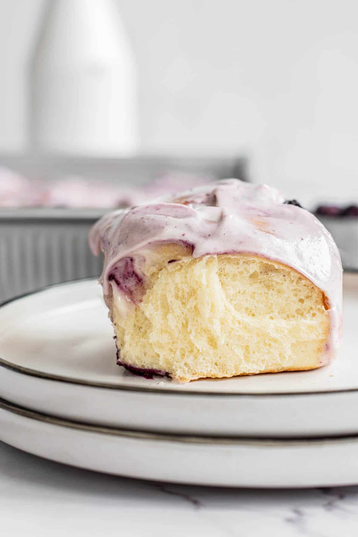 side view of fluffy looking blueberry cinnamon roll.