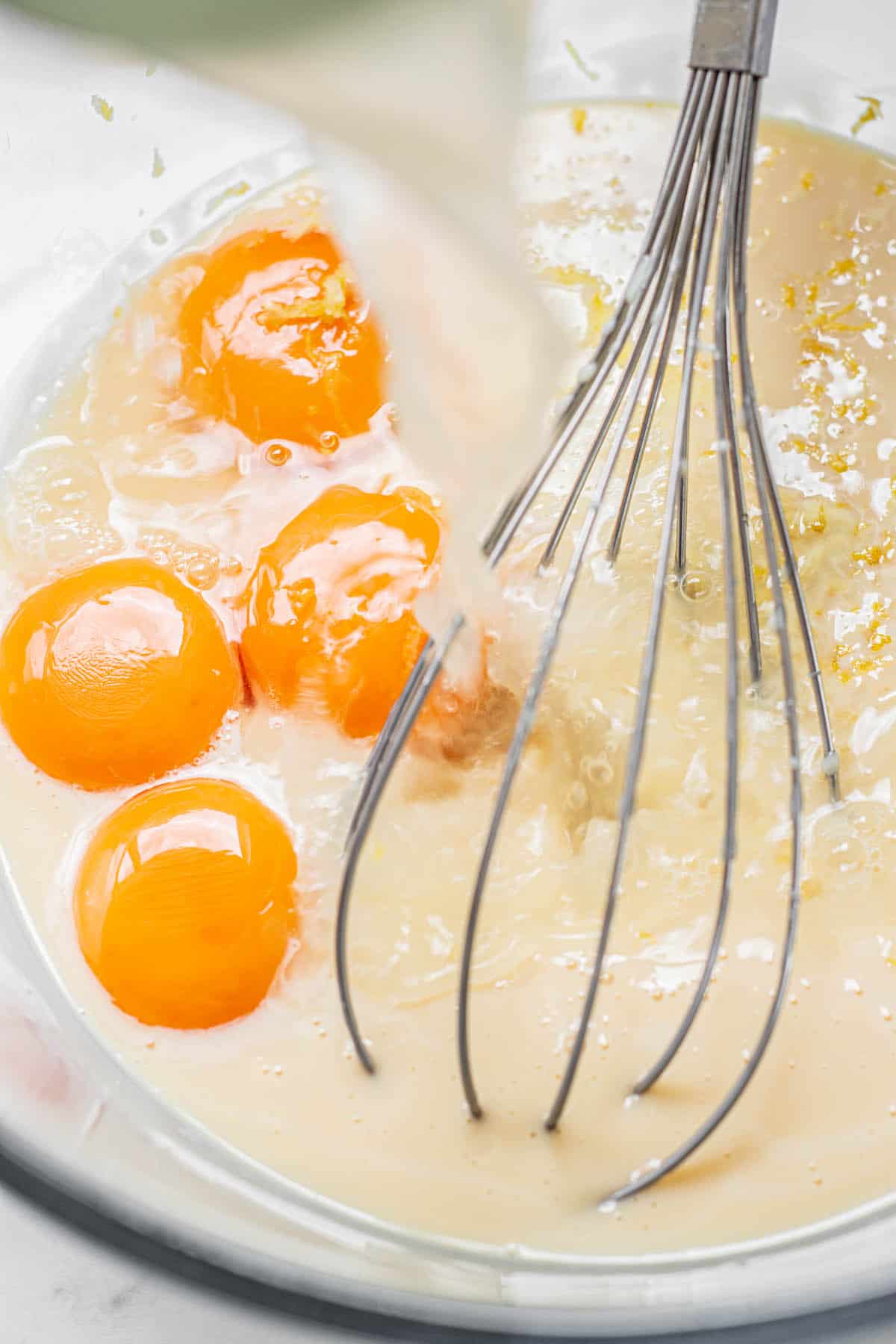 egg yolks, condensed milk and a whisk.