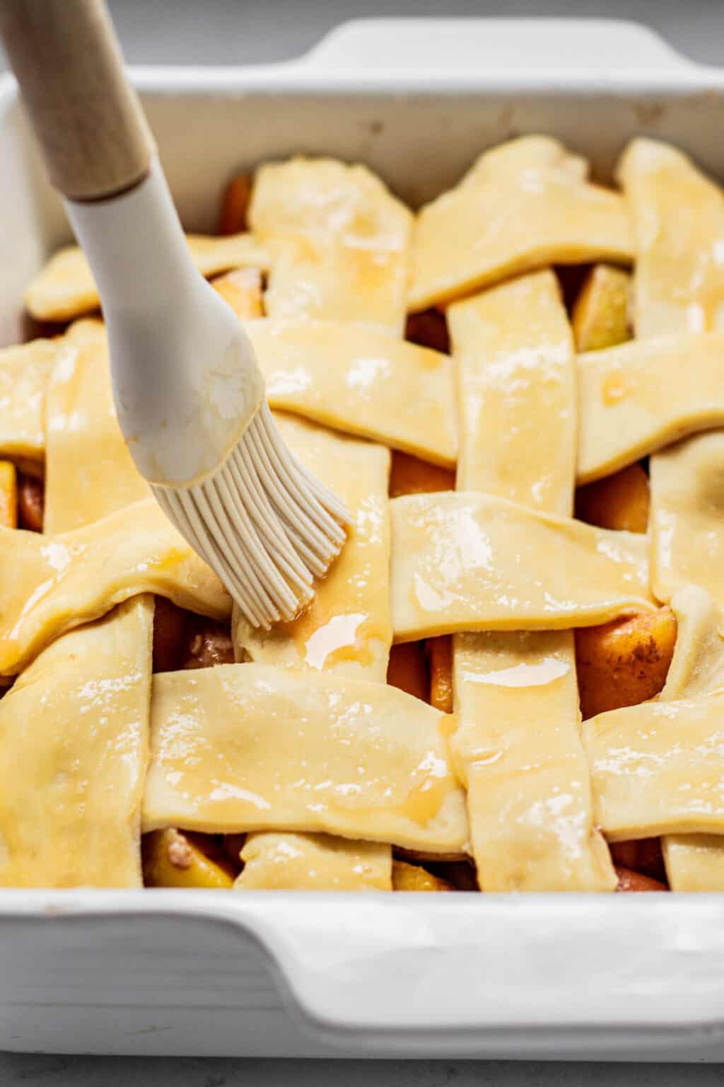 Peach Cobbler with Pie Crust Baking With Butter