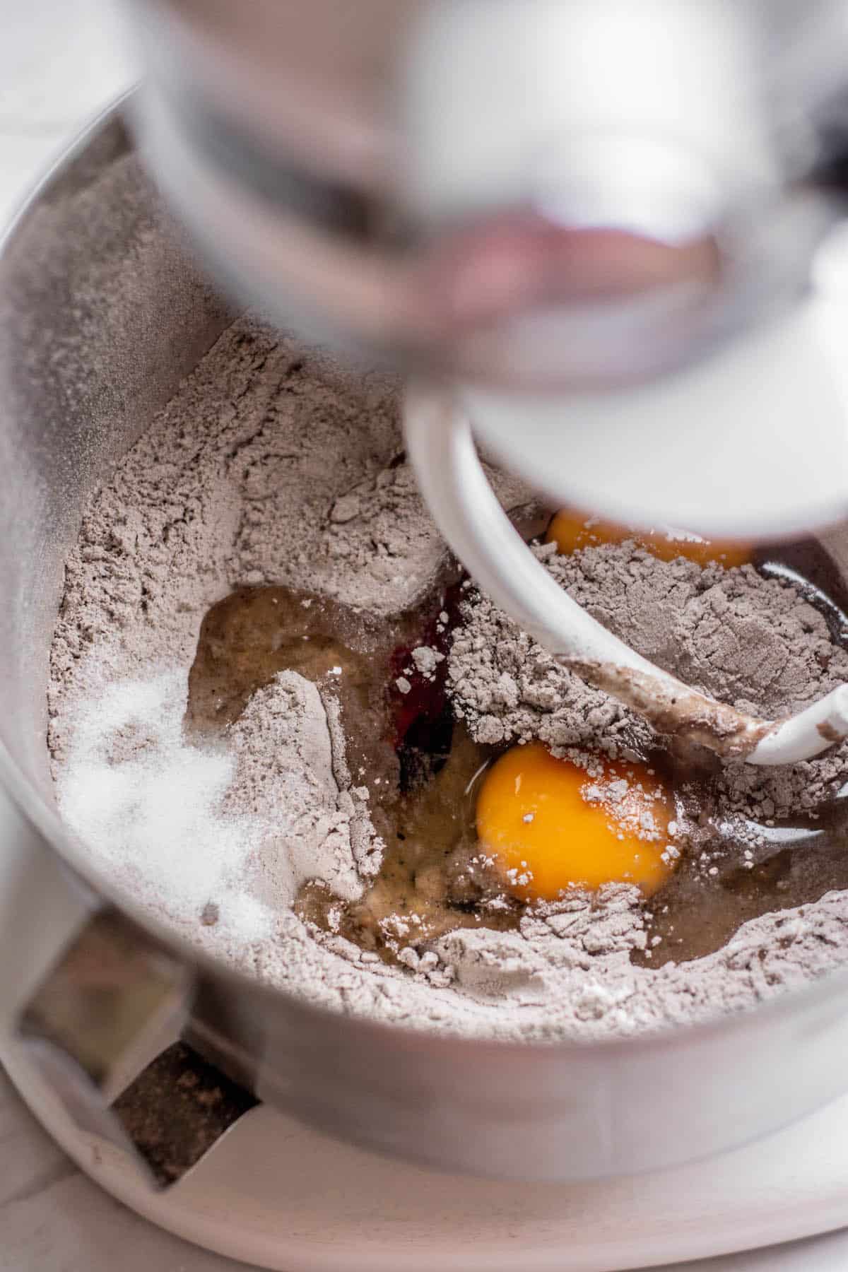 stand mixer with eggs, flour and cocoa