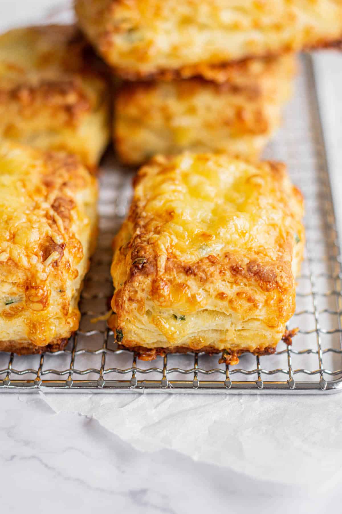 a silver rack of flaky cheese scones.