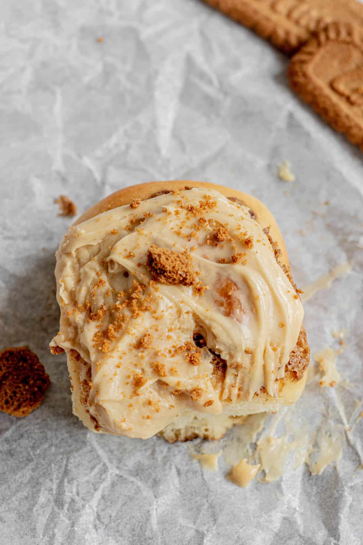 bird's eye view of cinnamon roll with crushed cookies.