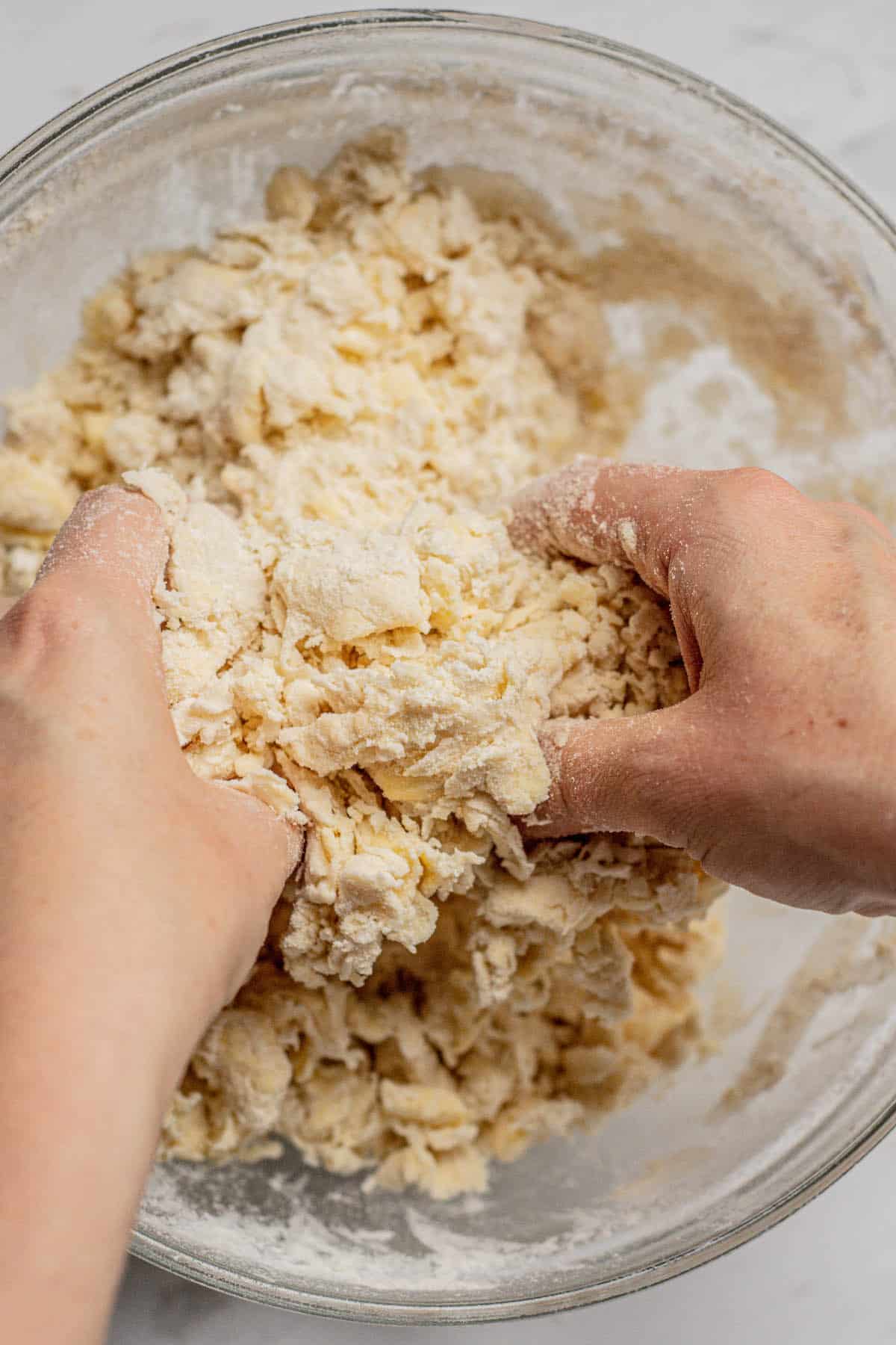 hands mixing pastry.