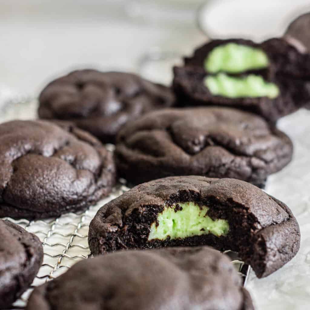 chocolate cookies bitten, with green cheesecake center.