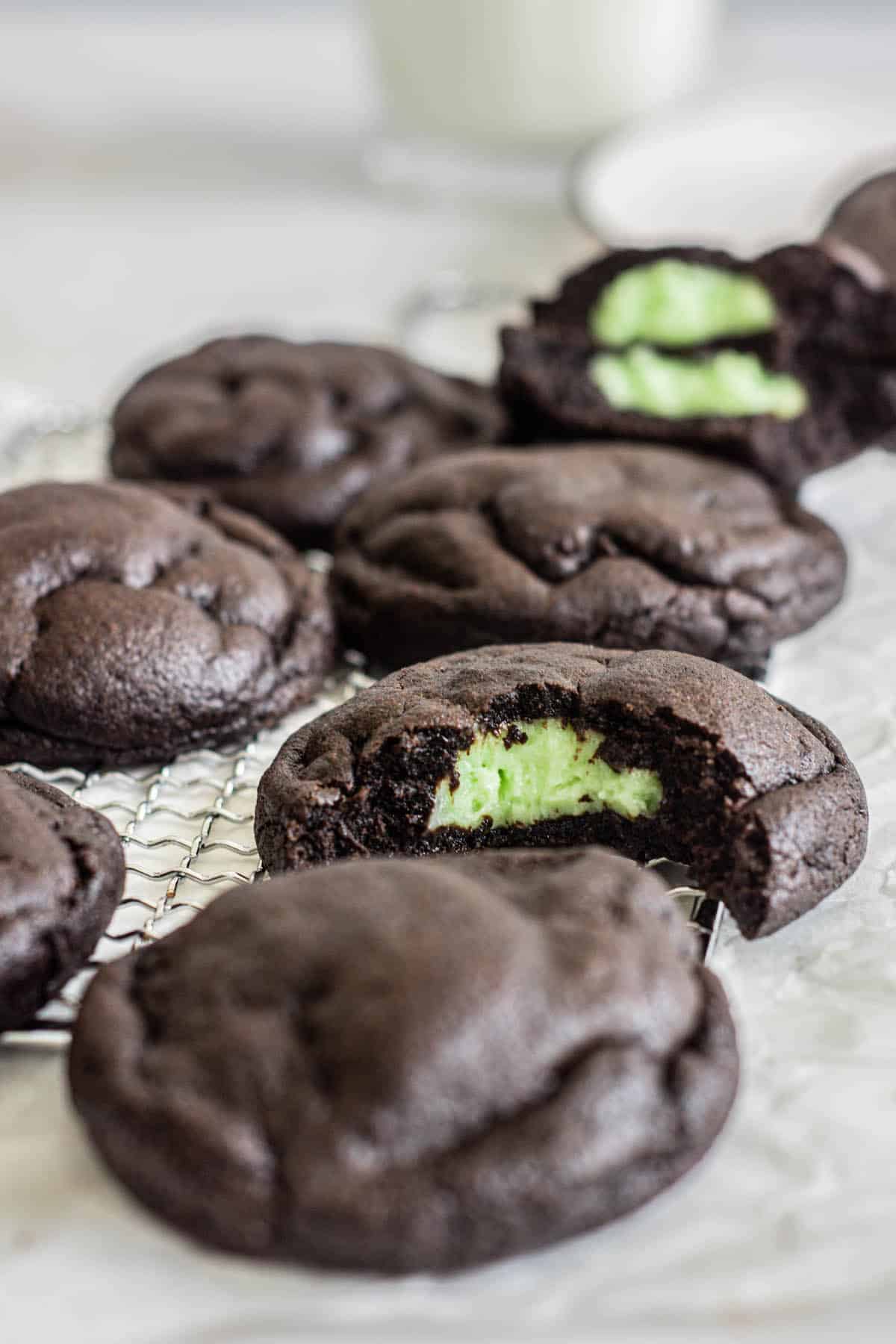 chocolate cookies bitten, with green cheesecake center.