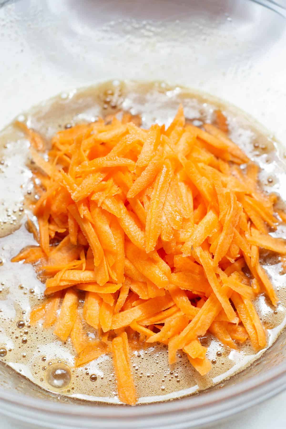 grated carrots in batter.