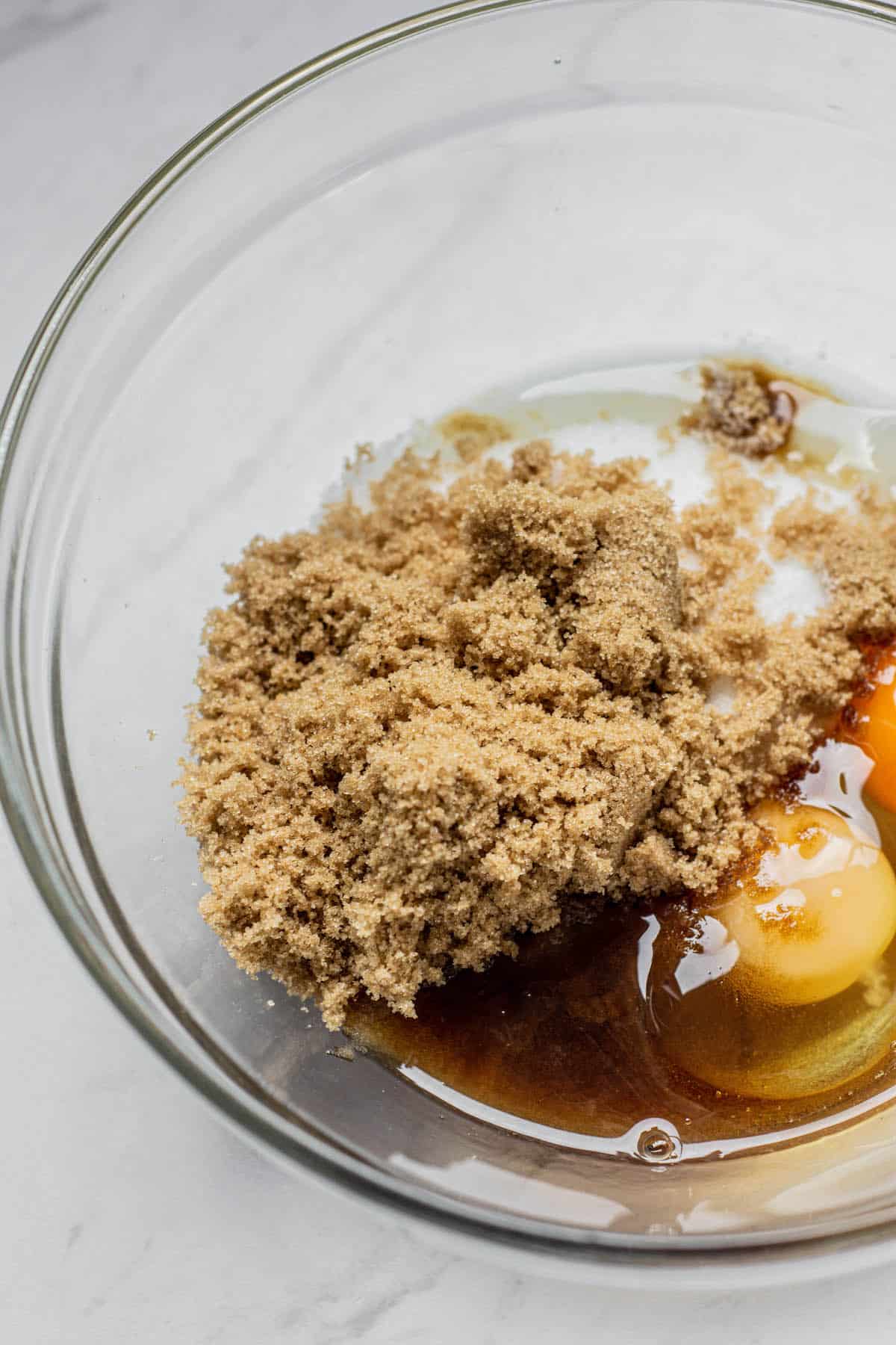 eggs, brown sugar and oil in a bowl.