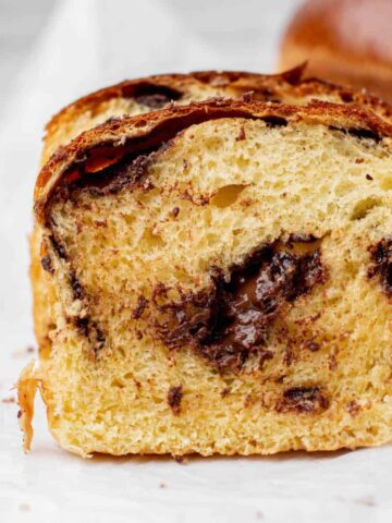 side view of brioche with melted chocolate.