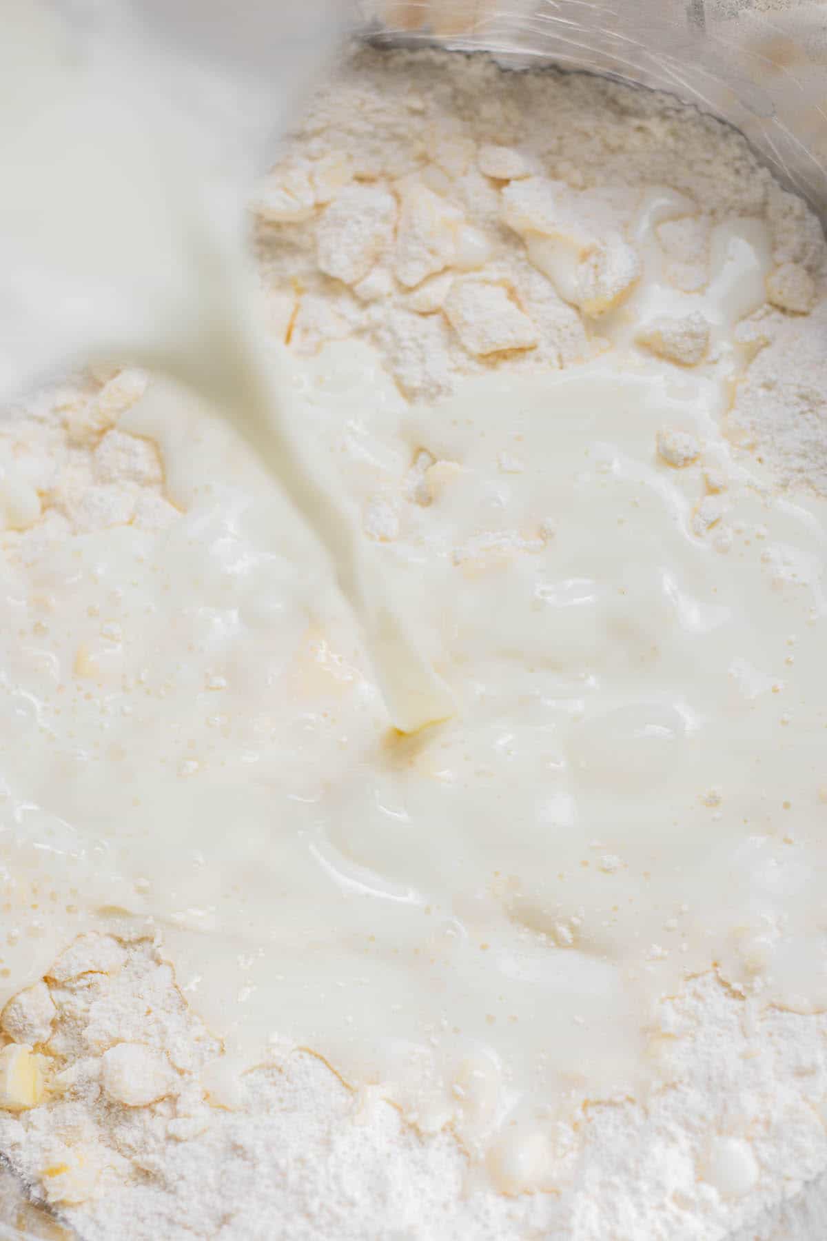 milk poured onto flour.