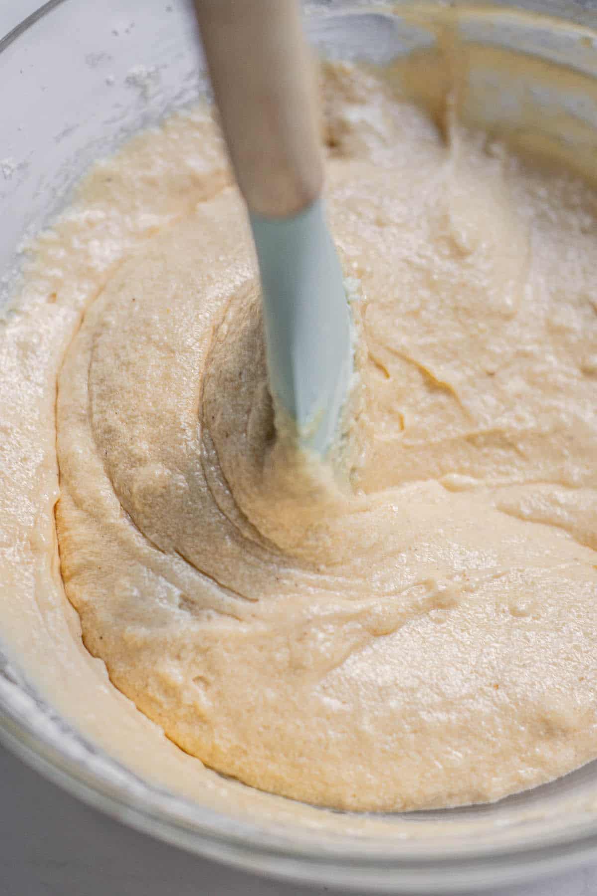 stirring batter in bowl.