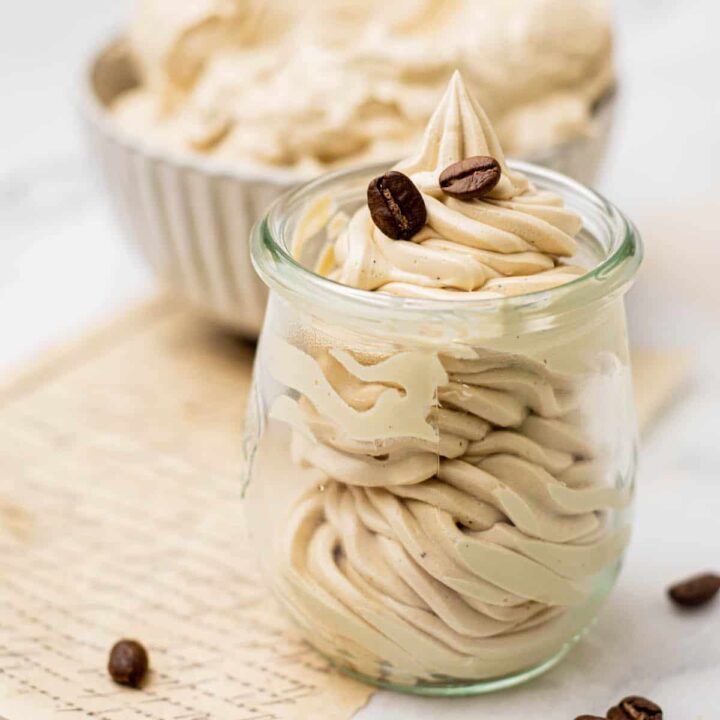 creamy coffee swiss meringue buttercream in little jar.