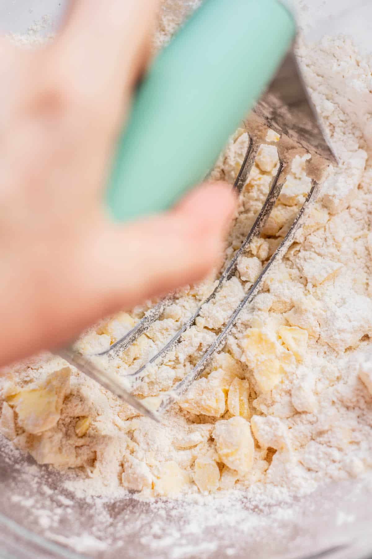 cutting butter into dough.